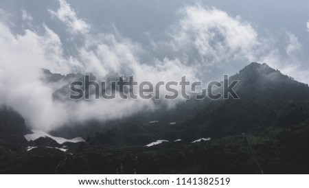 mountain silhouette and clouds