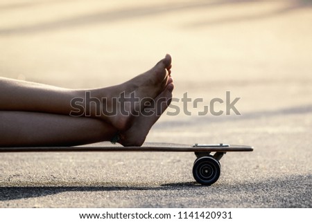 Girl's feet on skateboard