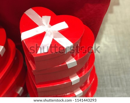Red heart boxes with white bow in a pile love box gift 