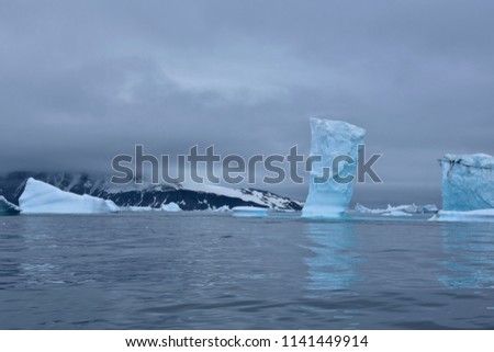 Stock pictures of ice on the ocean and mountains