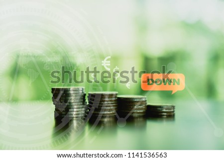Business financial success concept with currency icon and graph double expose on picture. Gold coins on table and green nature bokeh background. Bearish market situation.