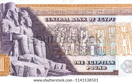 The statue of Ramses II and Nefertari In front of the Abu Simbel Cathedral In which he is considered a great Pharaoh,  Portrait from Egypt 1 pound 1967 banknote. 