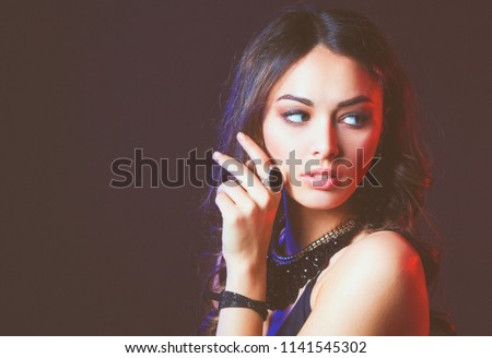 Portrait of beautiful young woman face. Isolated on black background.