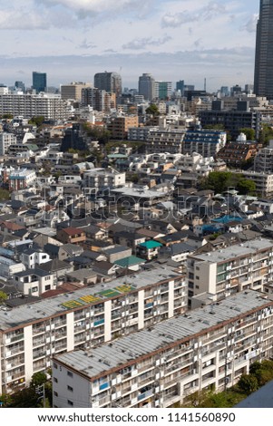 Aerial view of Tokyo buildings and skyline on a sunny day
