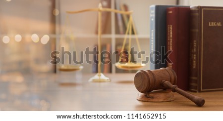 Judge gavel with law books and scales of justice. concept of justice, legal, jurisprudence. wide view.