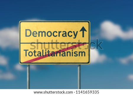 democracy totalitarianism  - yellow road sign 