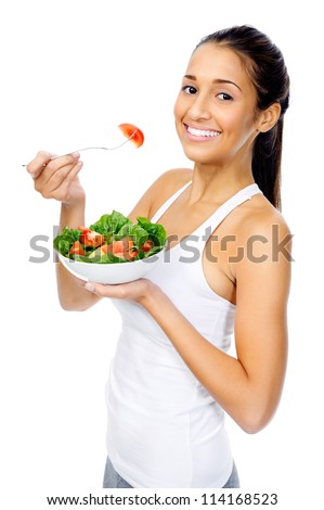 Healthy woman happy on diet eating an organic vegan or vegetarian salad as a snack isolated on white background