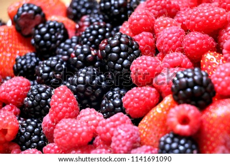 mix of strawberry,raspberry, blackberry.Group of berries,fruit background. Royalty-Free Stock Photo #1141691090
