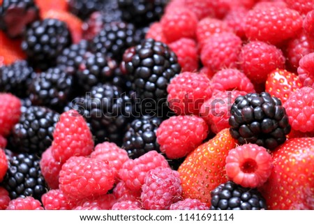 mix of strawberry,raspberry, blackberry.Group of berries,fruit background. Royalty-Free Stock Photo #1141691114