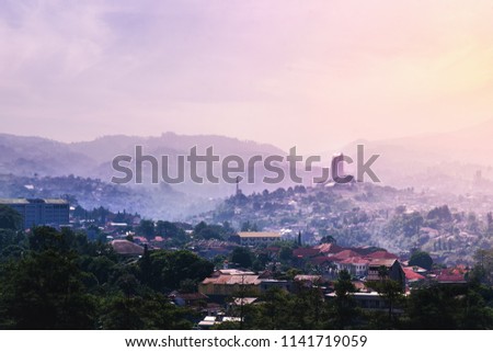 Landmark of Bandung From Dago Hill/Mountain at Sunrise on Misty and Fog Morning. Concept of Utopia Future Eco-friendly City Royalty-Free Stock Photo #1141719059