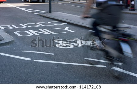 Speedy cyclist on bus and cycle lane. Motion blur'