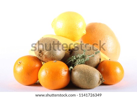 fresh fruits and vegetables lie on a white background