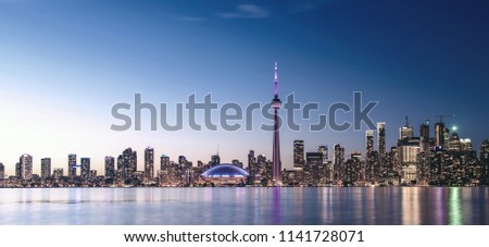 Toronto skyline at night with faded effect.