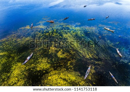 Aerial view of boats on Cau Hai lagoon in Tam Giang lagoon, Hue, Vietnam.