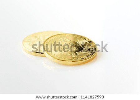 Golden bitcoin on a banknote with various items of business