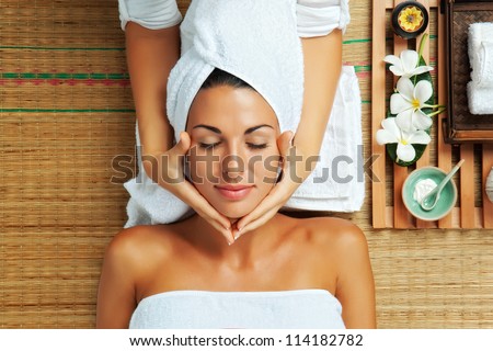 portrait of young beautiful woman in spa environment Royalty-Free Stock Photo #114182782