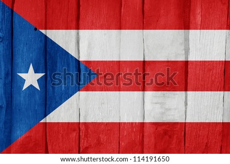 Wooden fence with the flag of Puerto Rico painted on it