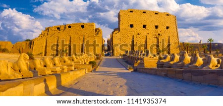 Karnak Temple sphinxes alley, The ruins of the temple Royalty-Free Stock Photo #1141935374