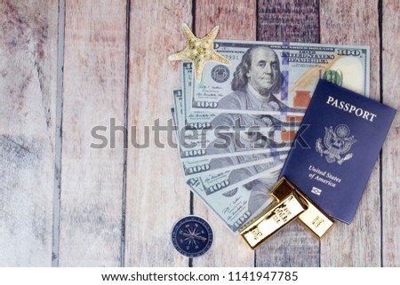 Gold bar,passport,bank note for the time of relaxation and tourism,Overhead view of Traveler's accessories, Essential vacation items, Travel concept background. Have a space for text.