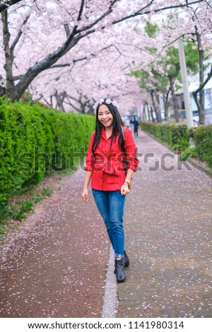 Young pretty girl traveling in Jinhae cherry blossom festival at Jinhae city of South Korea on April 2018.