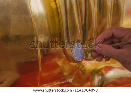 Buddha's fingers are painted white attached to the diamond, Wat Tha Sung,Thailand.