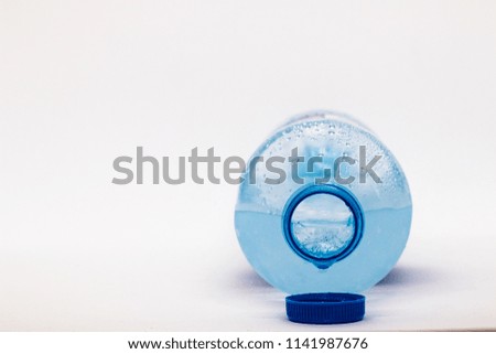 Frozen water. Bottle of drinking water. 