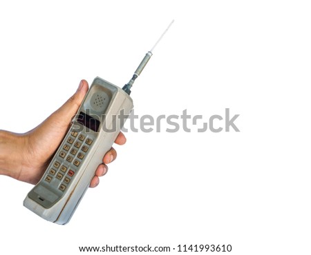 Close up rustic vintage mobile phone isolated on white background Royalty-Free Stock Photo #1141993610