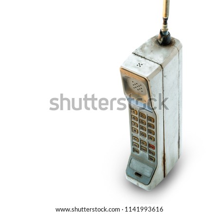 Close up rustic vintage mobile phone isolated on white background