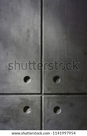 Close up gray cement wall and four point pattern and vertical and horizontal stripes