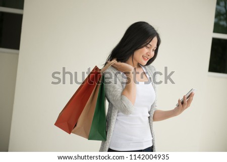 Portrait  of beautiful  girl happy smiling and shopping bags.