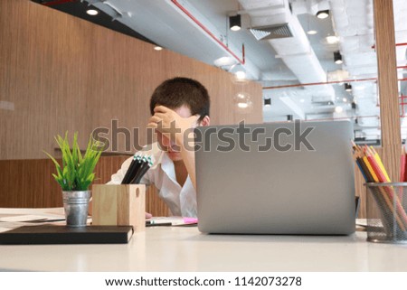 Businessman using credit card and laptop at home office