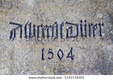 Close up  of the 1504 Dürer Stone commemorating Albrecht Dürer visit to Klausen / Chiusa - Italy. This commemorative stone made of blue-gray Diorite was placed and formally unveiled in 1912.
