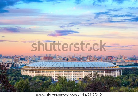 A view of the Luzhniki Stadium from Sparrow Hills at sunset. Moscow Royalty-Free Stock Photo #114212512
