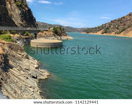Glory Hole, Lake Berryessa, California. Monticello Dam has a classic, uncontrolled morning-glory type spillway known as the Glory Hole. 
