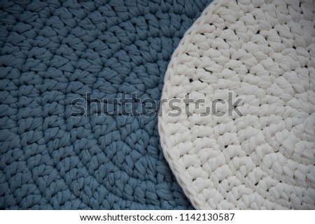 background knitted on knits by hand. color white-blue
