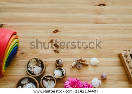 Group of learning materials of round and wooden colors on wooden table with space for text