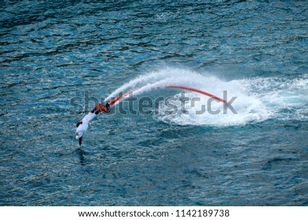 Fly board rider at sea. Extreme sport.