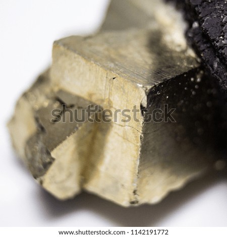 Natural pyrite natural cube cut with a metallic shine close up