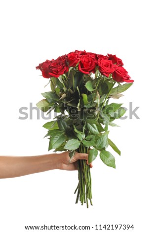 Woman holding beautiful red roses on white background