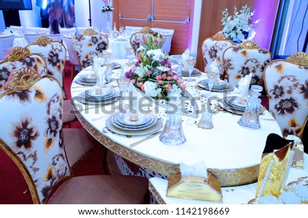 Royal wedding table decorated with flowers.
