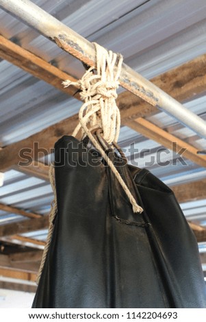  Black sand bags hanging in Boxing Stadium.  