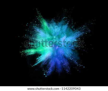 Explosion of coloured powder isolated on black background. Abstract colored background Royalty-Free Stock Photo #1142209043