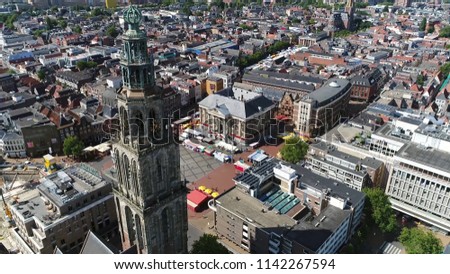 Aerial picture of the Martinitoren also called the St. Martin's Tower is highest church steeple in city of Groningen Netherlands and the bell tower of the Martinikerk als showing Grote Markt