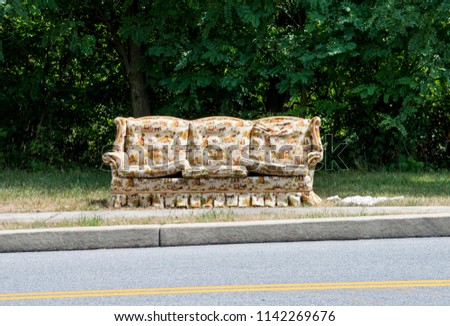 FREE Couch, sitting on the side of the road, very weathered