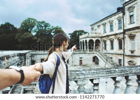 first person view of a woman tourist walking and make sightseeing old historic places in Lviv, Ukraine. Follow me concept photo