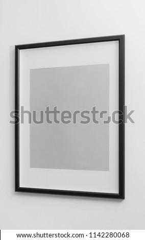 Side view of Black modern frame on white wall - Portrait wooden frame