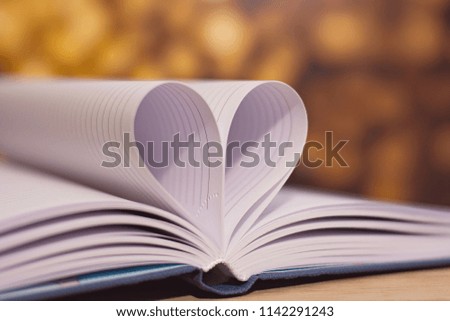 Heart from the pages of the book. Background. Valentine's Day.