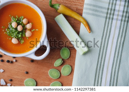 bright top view beautiful photo of vegan meal organic healthy diet pottage on wooden board with spices decoration,vegetables and kitchen cloth