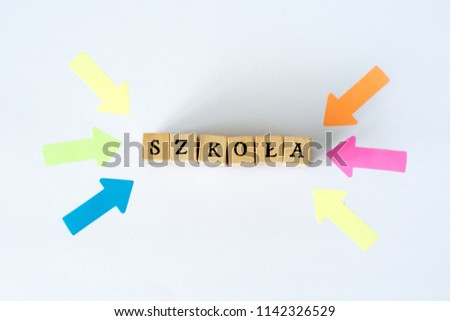 Word school written with wooden blocks, "szkoła" means school in polish
