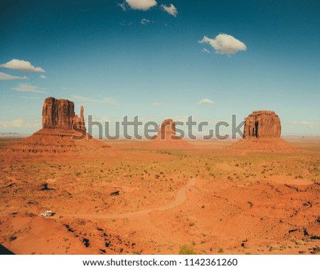 A beautiful view of blue sky and orange sand rocks, Monument Valley, Utah, USA